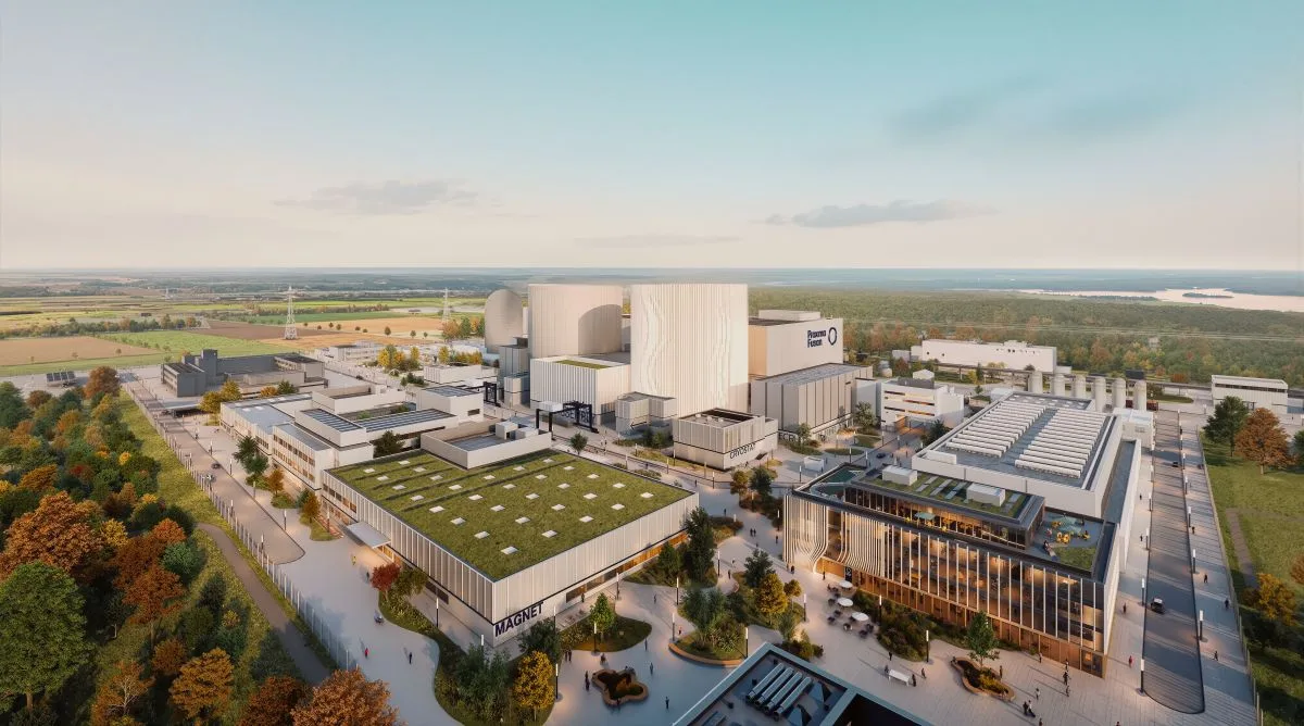 Der Plan als Skizze: In der Halle vorn im Bild, die hier die Aufschrift „Magnet“ trägt, will Proxima Fusion ab 2027 die Kabel- und später die Magnetproduktion starten. Später soll auf dem Ex-AKW-Gelände auch der Reaktor „Stellaris“ in Betrieb gehen. Rechts im Bild befindet sich das Zwischenlager, in dem bis zu einem aktuell noch offenen Zeitpunkt die abgebrannten Brennstäbe des ehemaligen AKW in Castoren lagern. Ein Café, wie auf der Skizze, gibt es dort bislang nicht.  